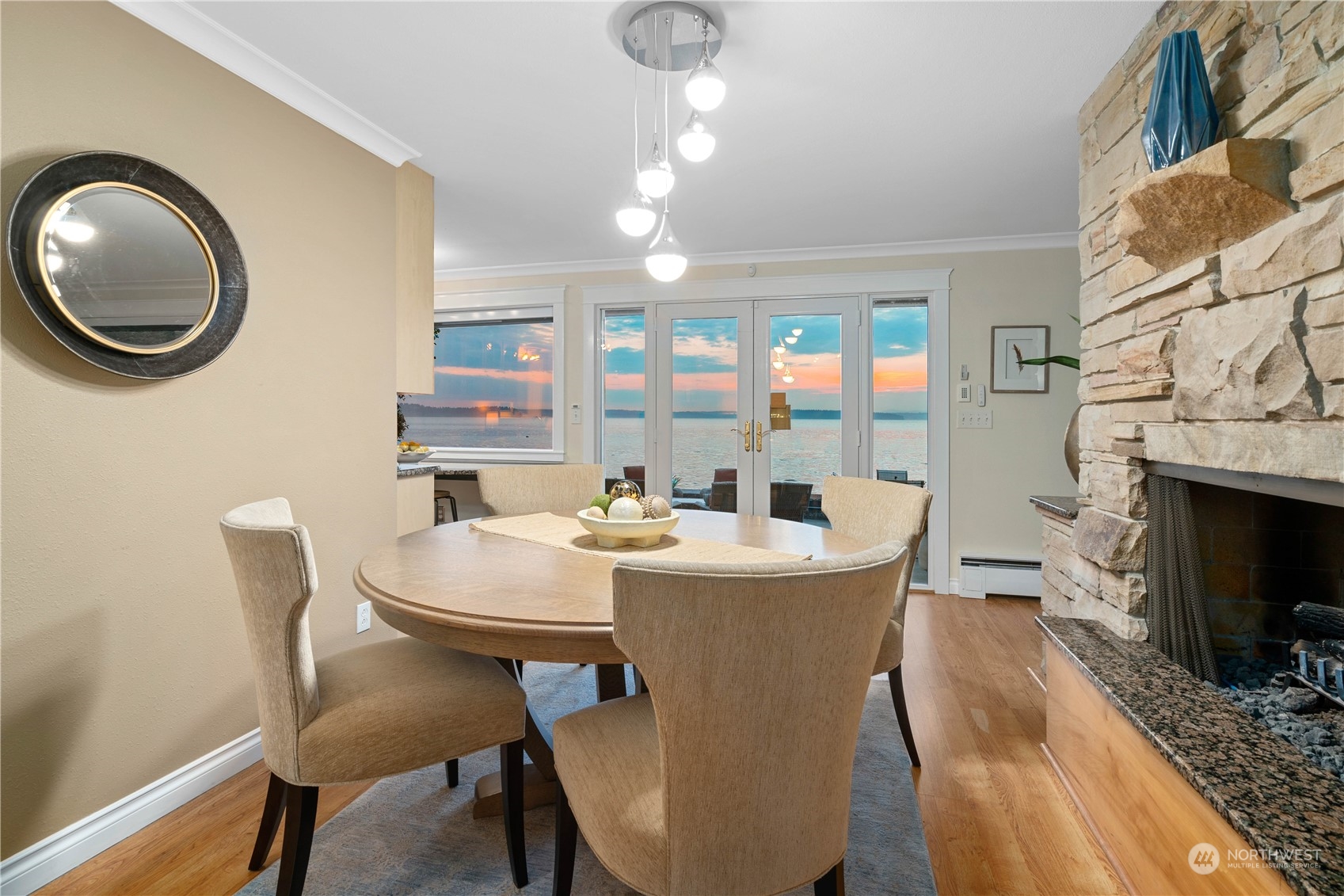 7127 Beach Drive Southwest Seattle, WA 98136 - Photo 13 of 33 a dining room with a wooden table and chairs