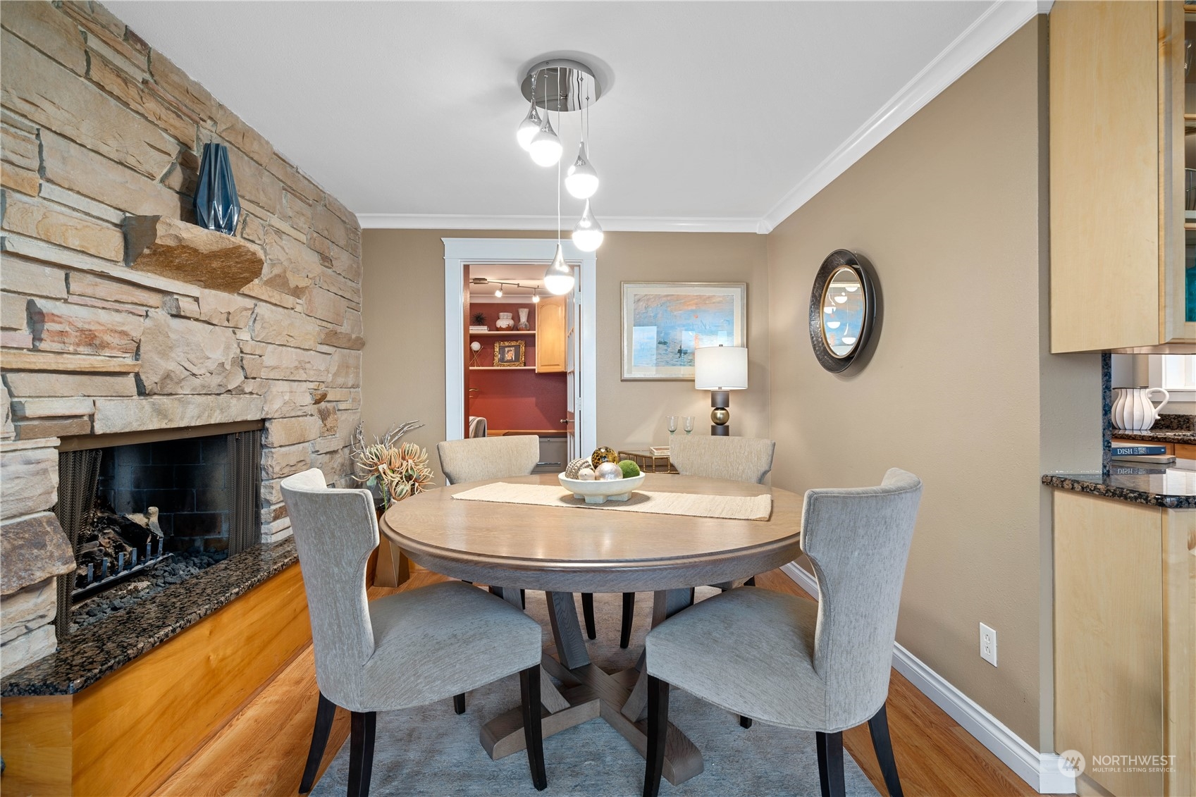 7127 Beach Drive Southwest Seattle, WA 98136 - Photo 14 of 33 a view of a dining room with furniture and a fireplace