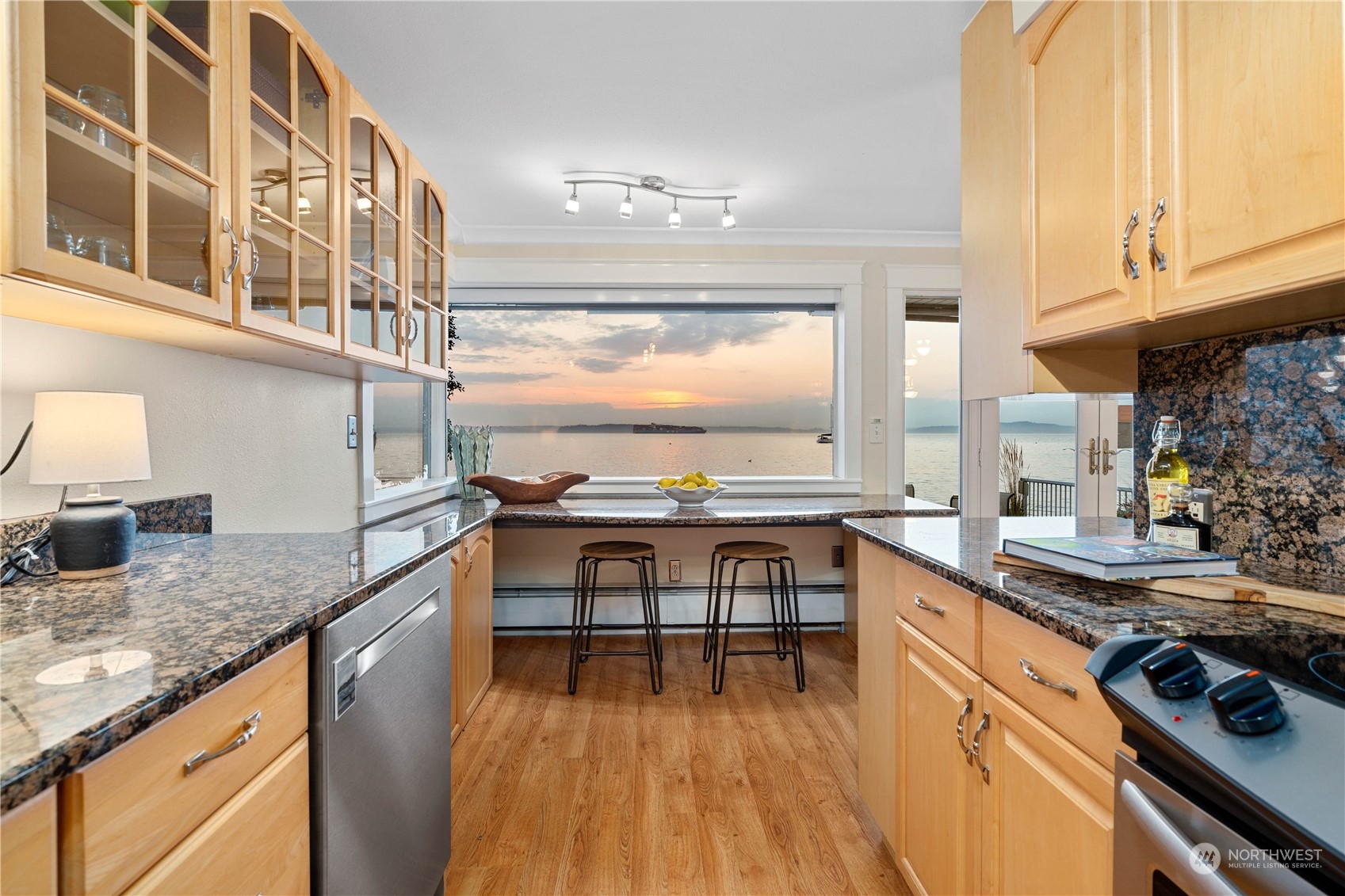 7127 Beach Drive Southwest Seattle, WA 98136 - Photo 16 of 33 a kitchen with a sink stove and cabinets