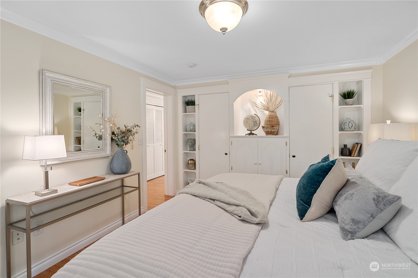 7127 Beach Drive Southwest Seattle, WA 98136 - Photo 21 of 33 a bedroom with a bed and a potted plant