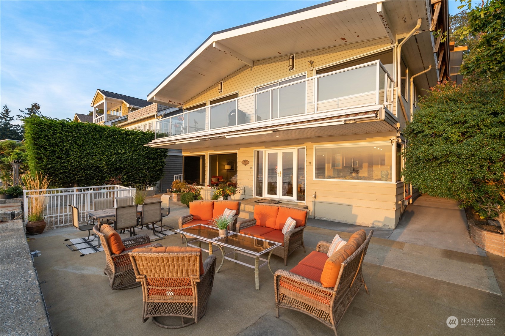 7127 Beach Drive Southwest Seattle, WA 98136 - Photo 6 of 33 a view of a patio with couches table and chairs and potted plants