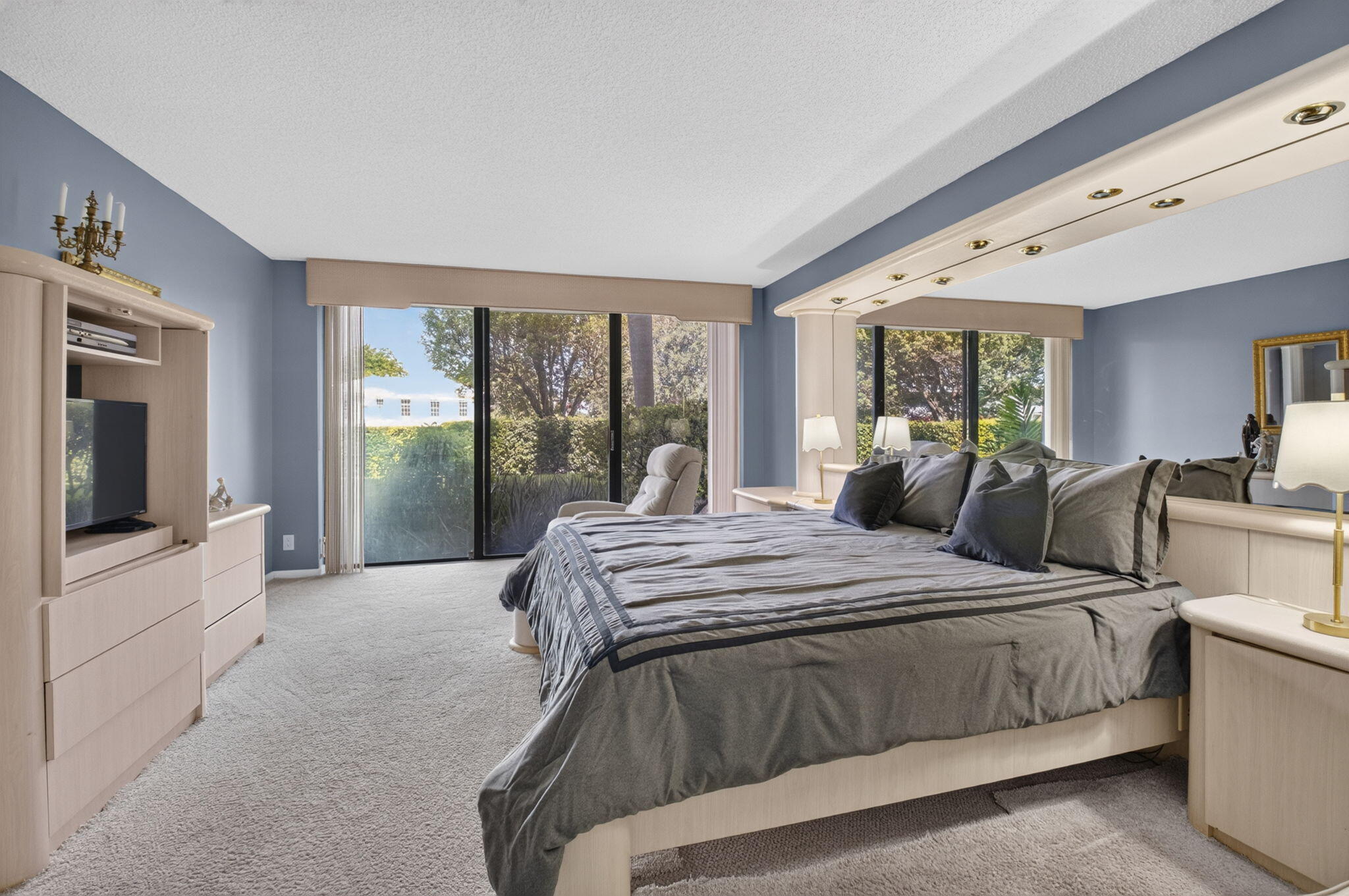 1401 South Ocean Boulevard, Unit 1060 Boca Raton, FL 33432 - Photo 17 of 46 a large bedroom with a bed and large windows