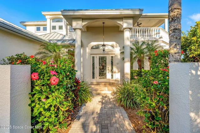 a kitchen with granite countertop a refrigerator stove top oven and sink