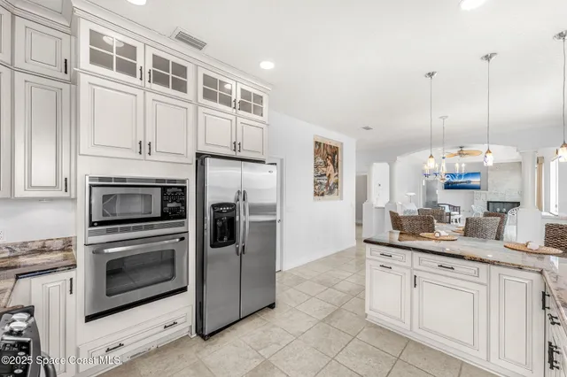 a view of a hallway with washer and dryer