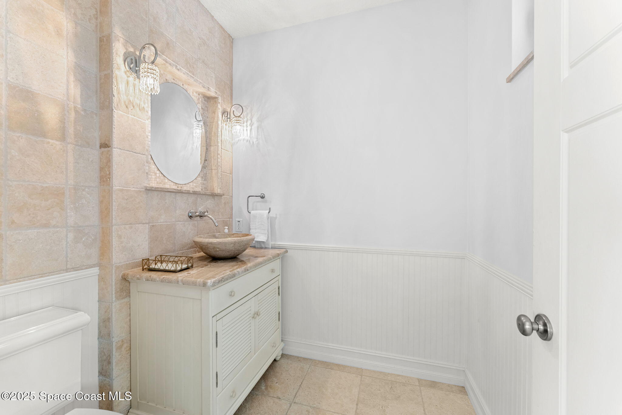 5795 Florida A1A Melbourne Beach, FL 32951 - Photo 25 of 71 a bathroom with a granite countertop sink a toilet and a mirror