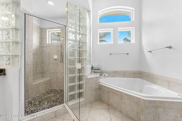 a bathroom with a toilet sink and shower