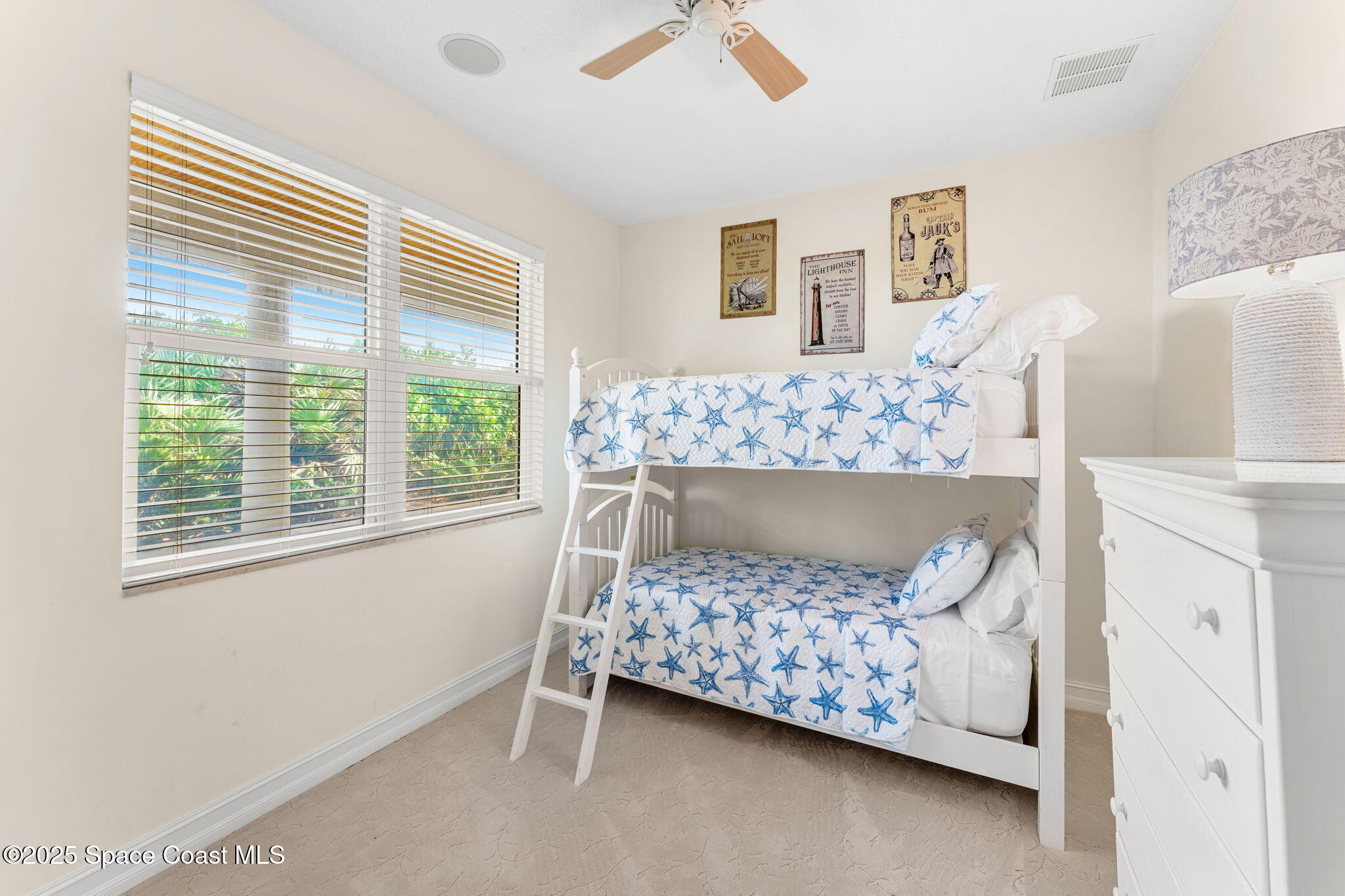 5795 Florida A1A Melbourne Beach, FL 32951 - Photo 35 of 71 a bedroom with a bed and a window