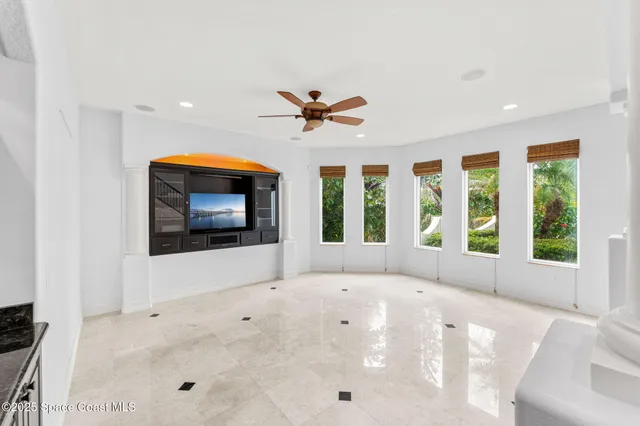 a view of a house with a flower garden