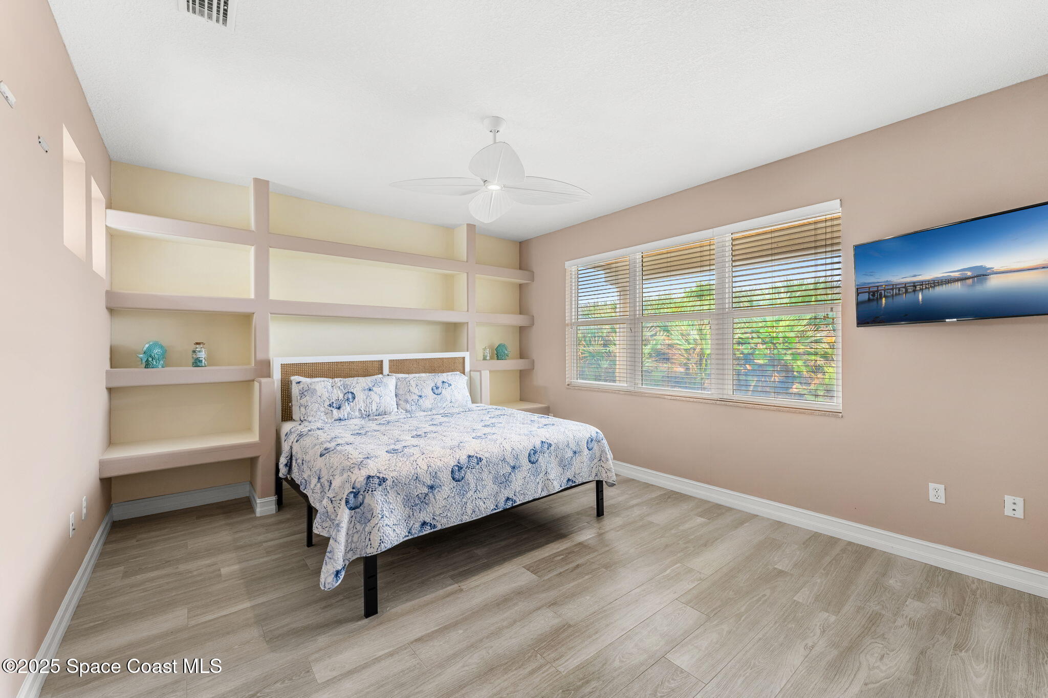5795 Florida A1A Melbourne Beach, FL 32951 - Photo 57 of 71 a bedroom with a bed and a window