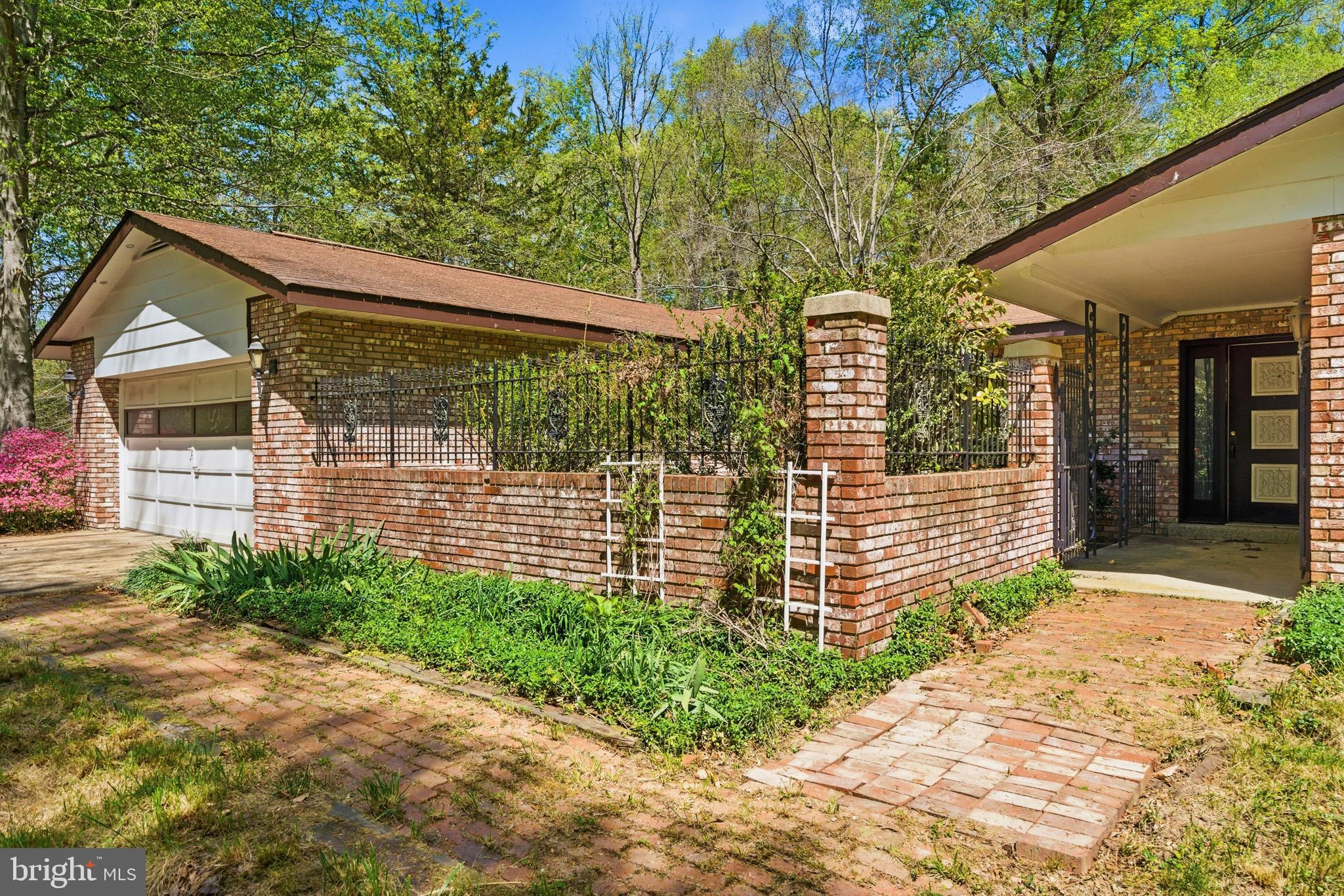2270 Liverpool Point Road Nanjemoy, MD 20662 - Photo 34 of 39 Brick fenced patio/garden