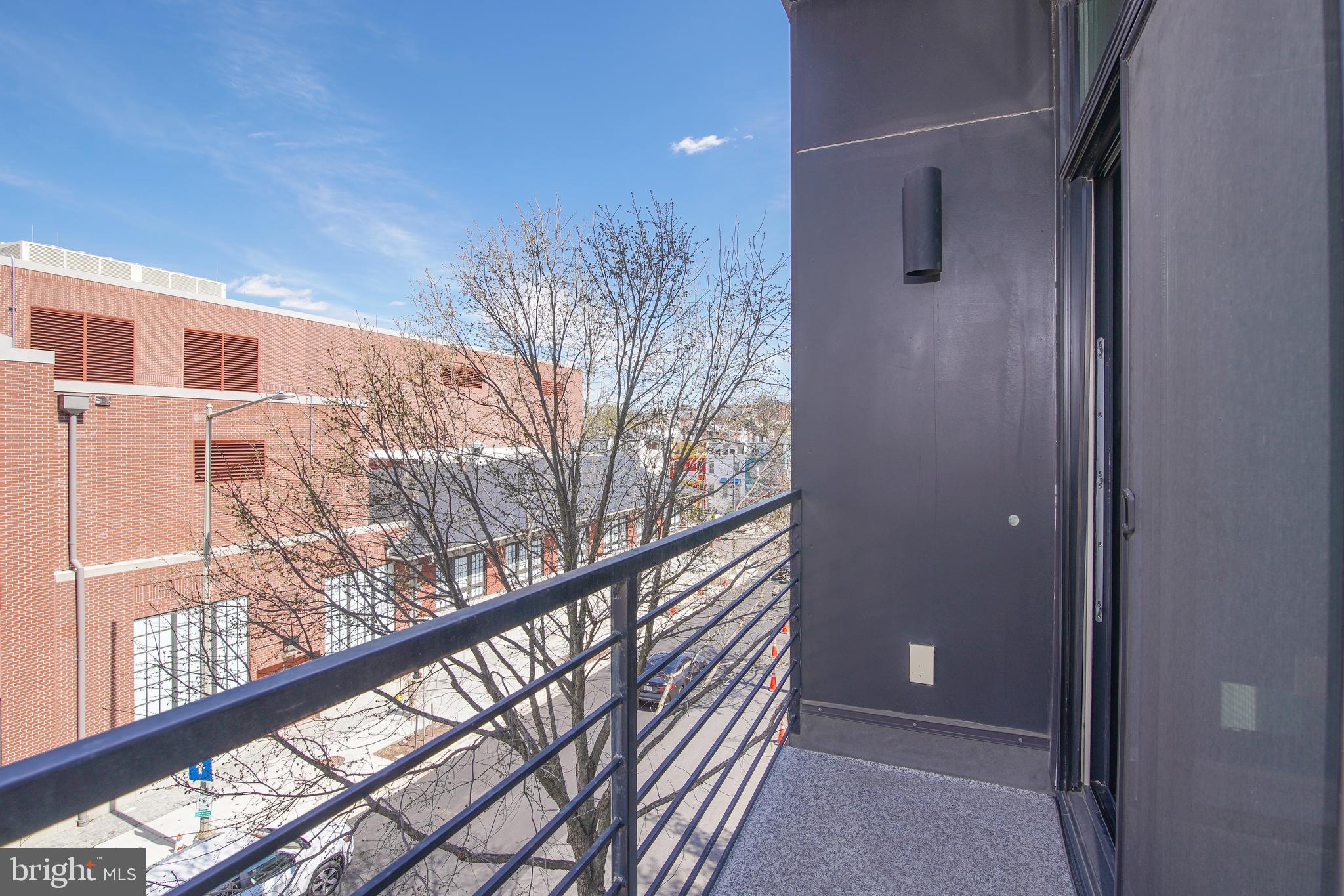 1012 Harvard Street Northwest, Unit 8 Washington, DC 20001 - Photo 22 of 34 a view of a house with a tree