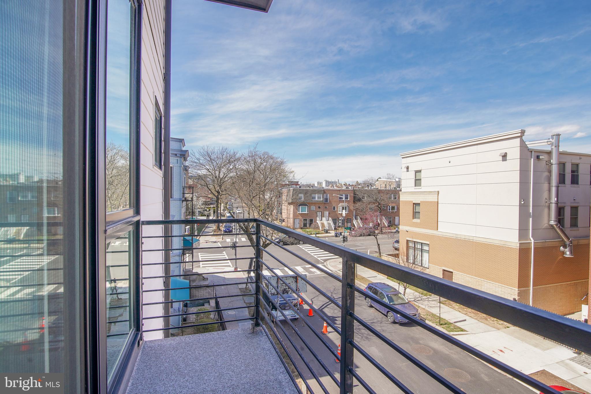1012 Harvard Street Northwest, Unit 8 Washington, DC 20001 - Photo 23 of 34 a view of city from a balcony