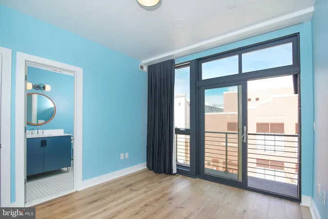 a bedroom with a bed and a ceiling fan