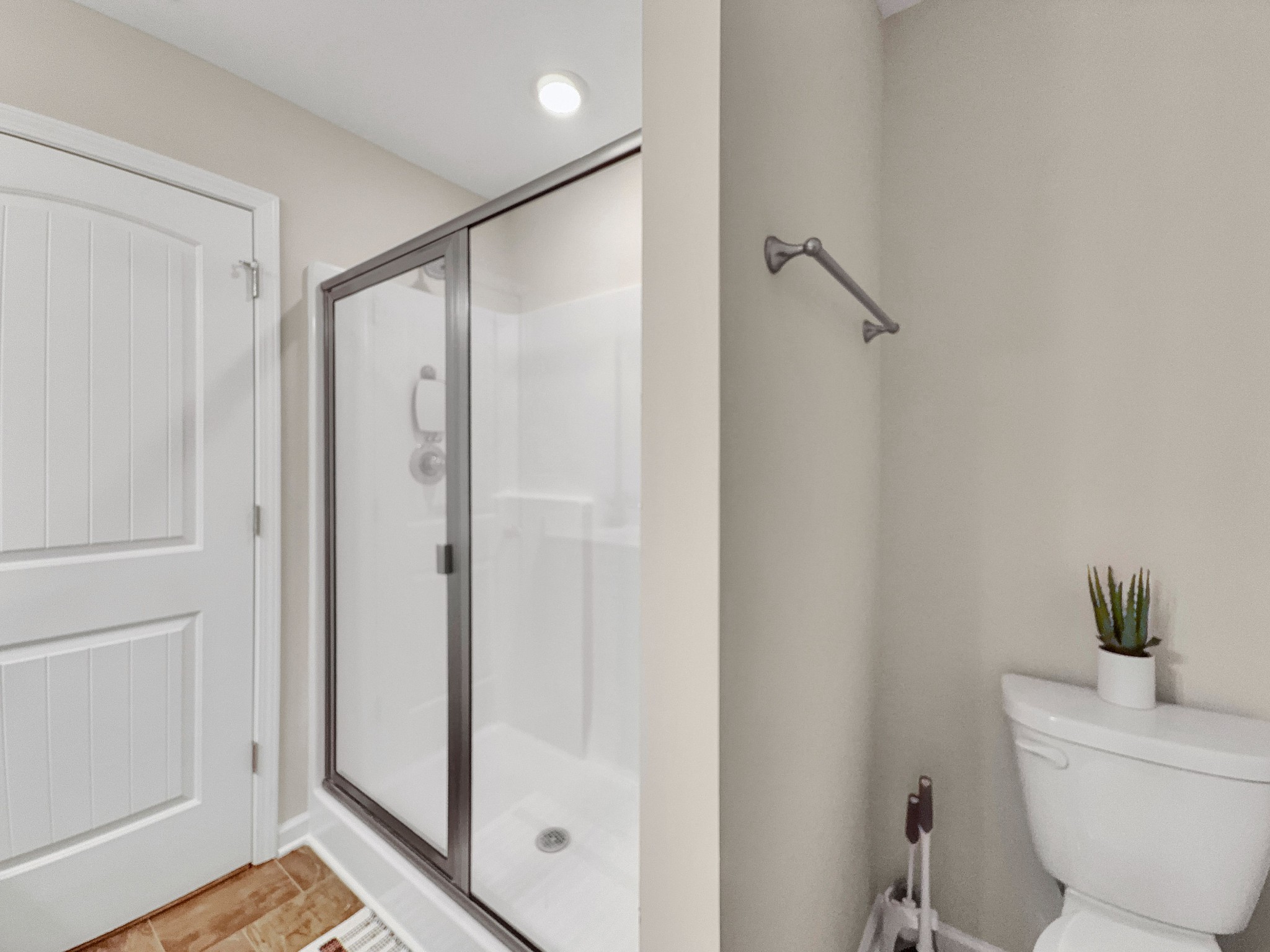 147 Addi Street Pleasant View, TN 37146 - Photo 18 of 27 a bathroom with a shower and a toilet