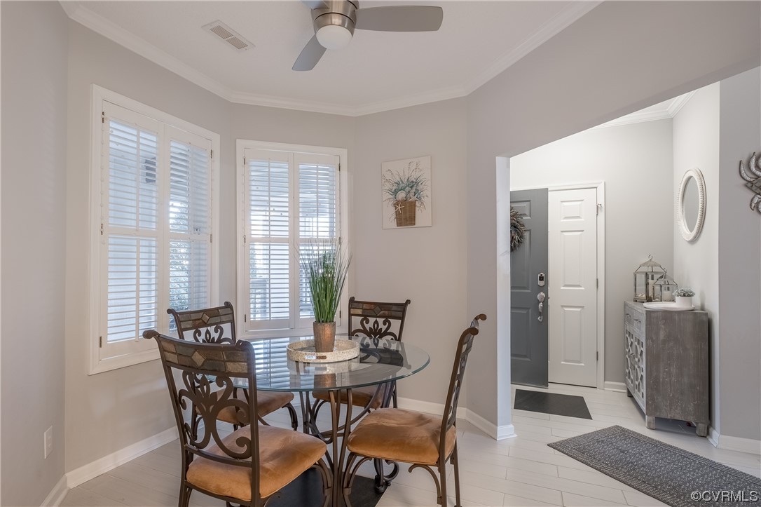 1003 High Dunes Quay, Unit 101 Hampton, VA 23664 - Photo 23 of 42 a view of a dining room with furniture and windows
