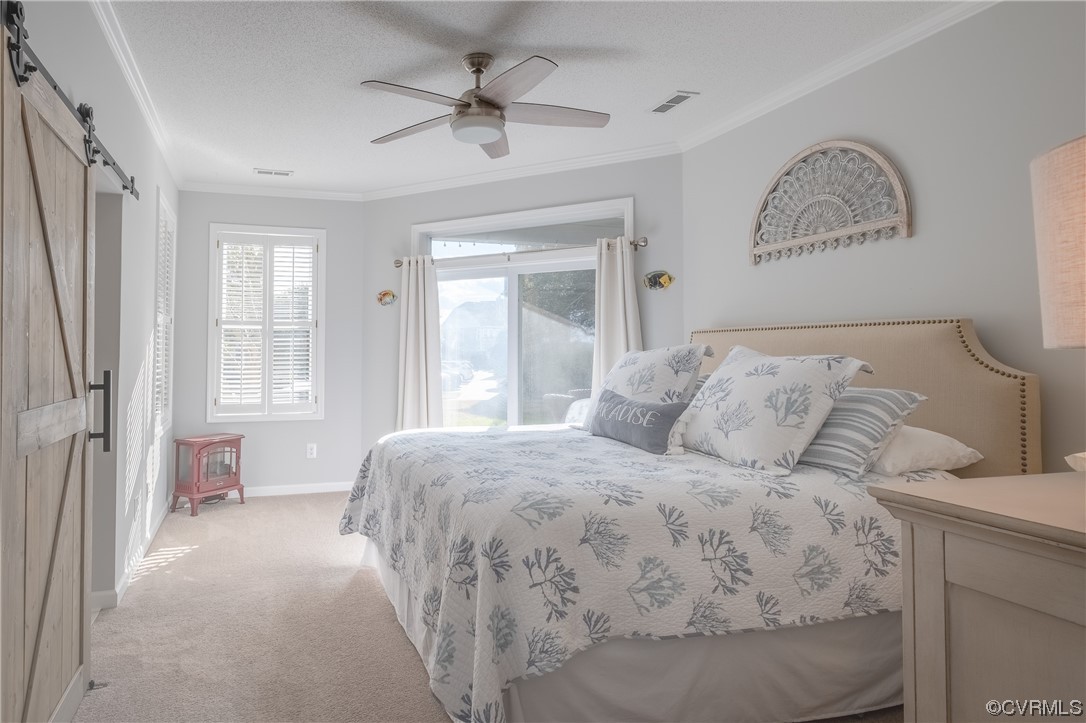 1003 High Dunes Quay, Unit 101 Hampton, VA 23664 - Photo 27 of 42 a bedroom with a large bed and a window