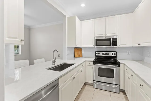 a room with a sink and cabinets