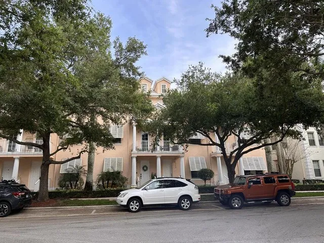 a view of cars parked in front of a building