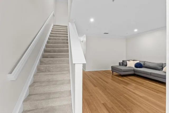 an empty room with a ceiling fan and a window