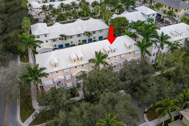 an aerial view of a houses with yard