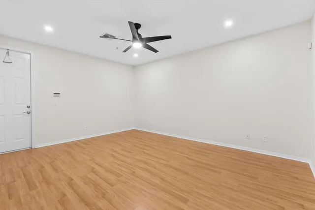 a view of staircase with white walls