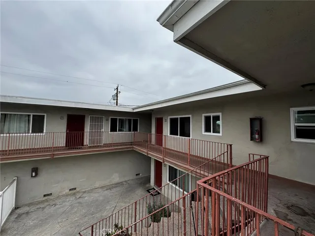 a view of a house with wooden deck and a flat screen tv