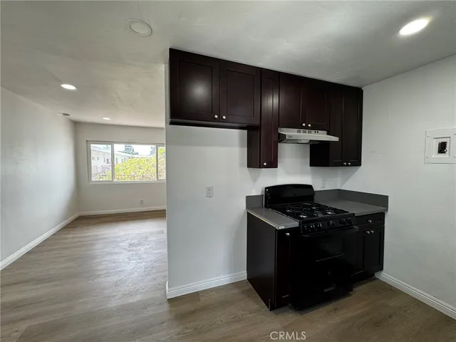 a kitchen with a stove and a refrigerator