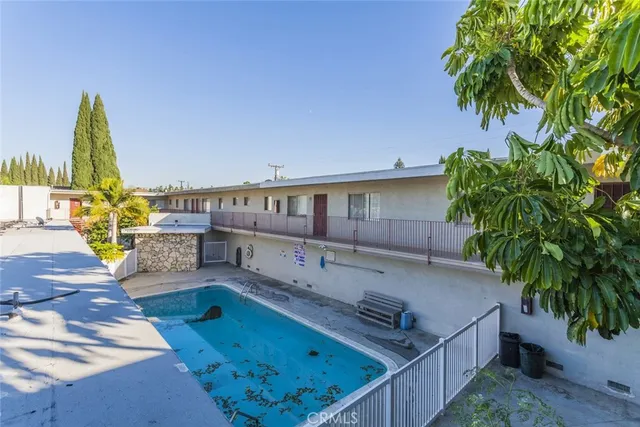 a view of a swimming pool with a patio
