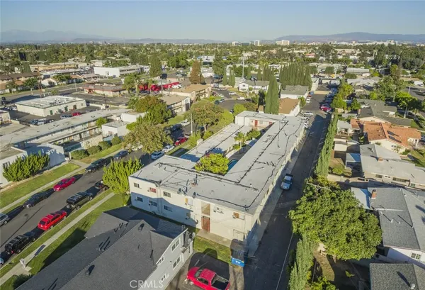 an aerial view of residential houses with outdoor space