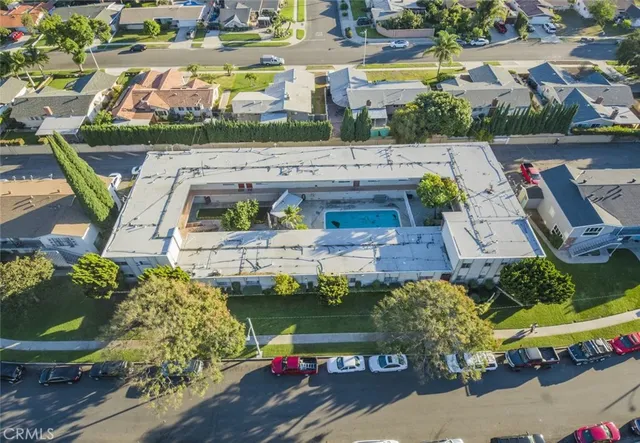a view of swimming pool with outdoor seating and plants