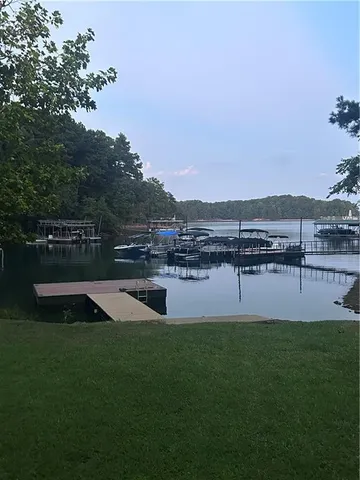 a swimming pool with outdoor seating and yard