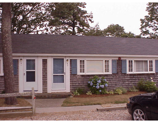 82 Lower County Road, Unit 2 Dennis, MA 02639 - Photo 1 of 7 front view of house with a yard