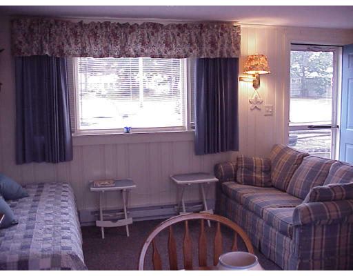 82 Lower County Road, Unit 2 Dennis, MA 02639 - Photo 3 of 7 a living room with furniture and a window
