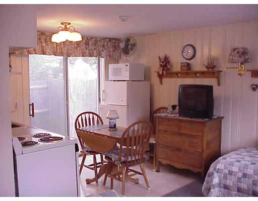 82 Lower County Road, Unit 2 Dennis, MA 02639 - Photo 4 of 7 a dining room with furniture and window