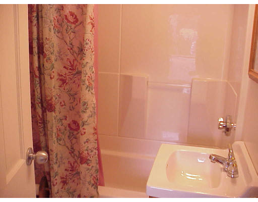 82 Lower County Road, Unit 2 Dennis, MA 02639 - Photo 5 of 7 a bathroom with a bathtub and shower