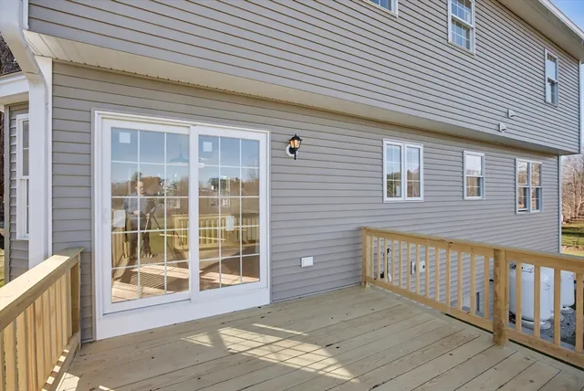 a view of a house with wooden deck