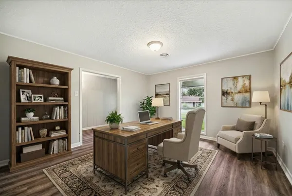 a living room with furniture and wooden floor