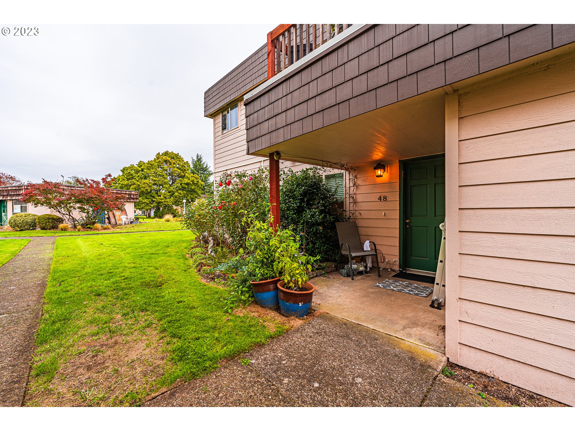 2727 Gateway Street, Unit 48 Springfield, OR 97477 - Photo 1 of 25 a view of a backyard with plants
