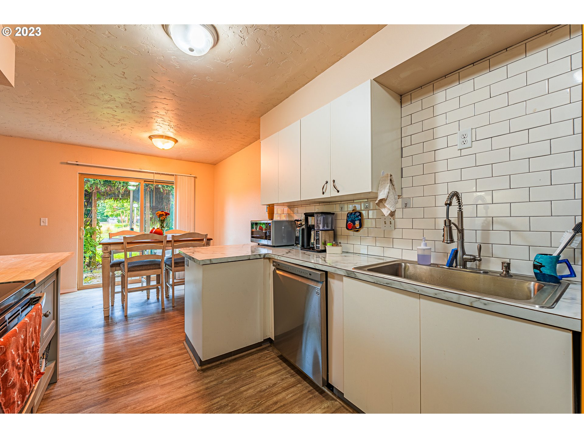 2727 Gateway Street, Unit 48 Springfield, OR 97477 - Photo 13 of 25 a kitchen with a sink cabinets and window