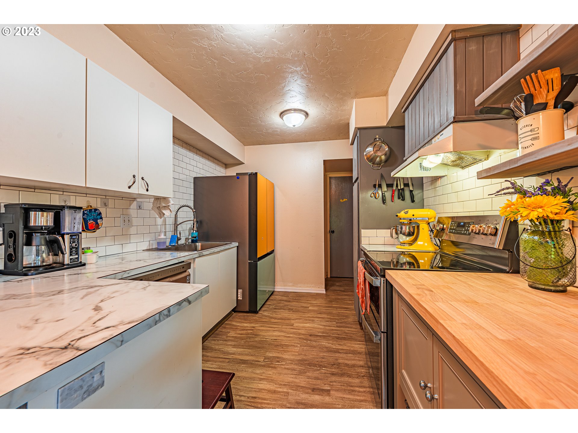 2727 Gateway Street, Unit 48 Springfield, OR 97477 - Photo 10 of 25 a kitchen with stainless steel appliances granite countertop sink stove and refrigerator