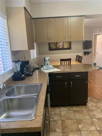a kitchen with a sink and cabinets