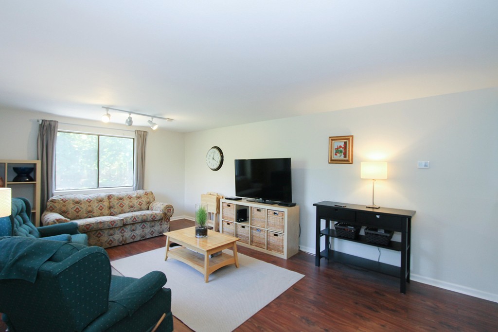 41 Leland Farm Road, Unit 41 Ashland, MA 01721 - Photo 3 of 9 a living room with furniture and a flat screen tv