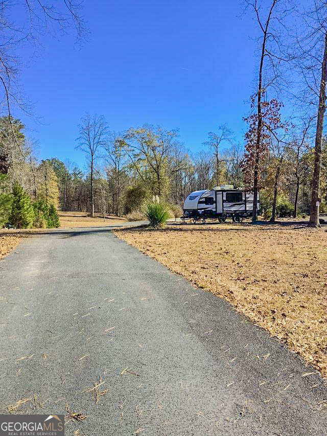 262 Nelms Road Fayetteville, GA 30215 - Photo 2 of 8 a view of a road with a building in the background