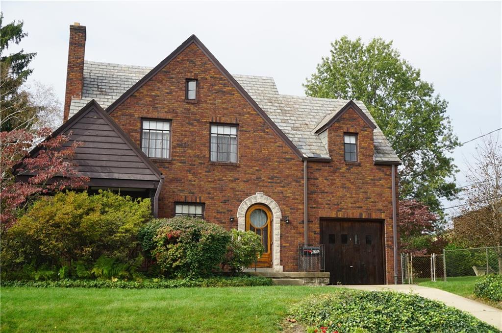 811 East Monroe Circle Pittsburgh, PA 15229 - Photo 1 of 11 a front view of a house with garden