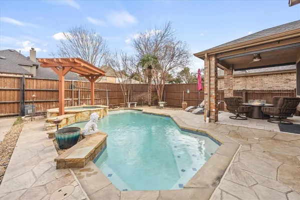 a view of a swimming pool with a lounge chair