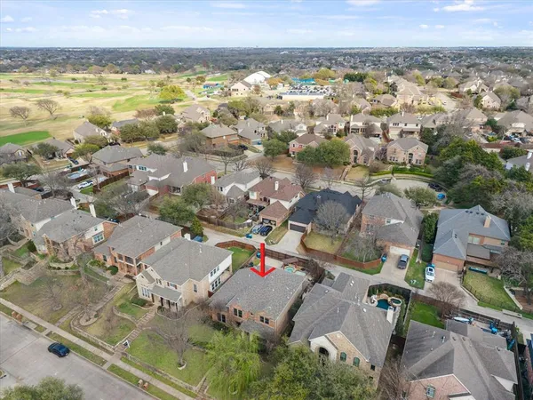 an aerial view of residential building and lake