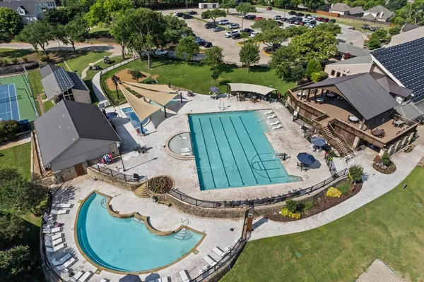 an aerial view of a house with outdoor space