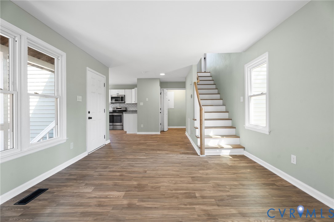 11101 Timonium Drive Chester, VA 23831 - Photo 9 of 21 a view of empty room with wooden floor and windows