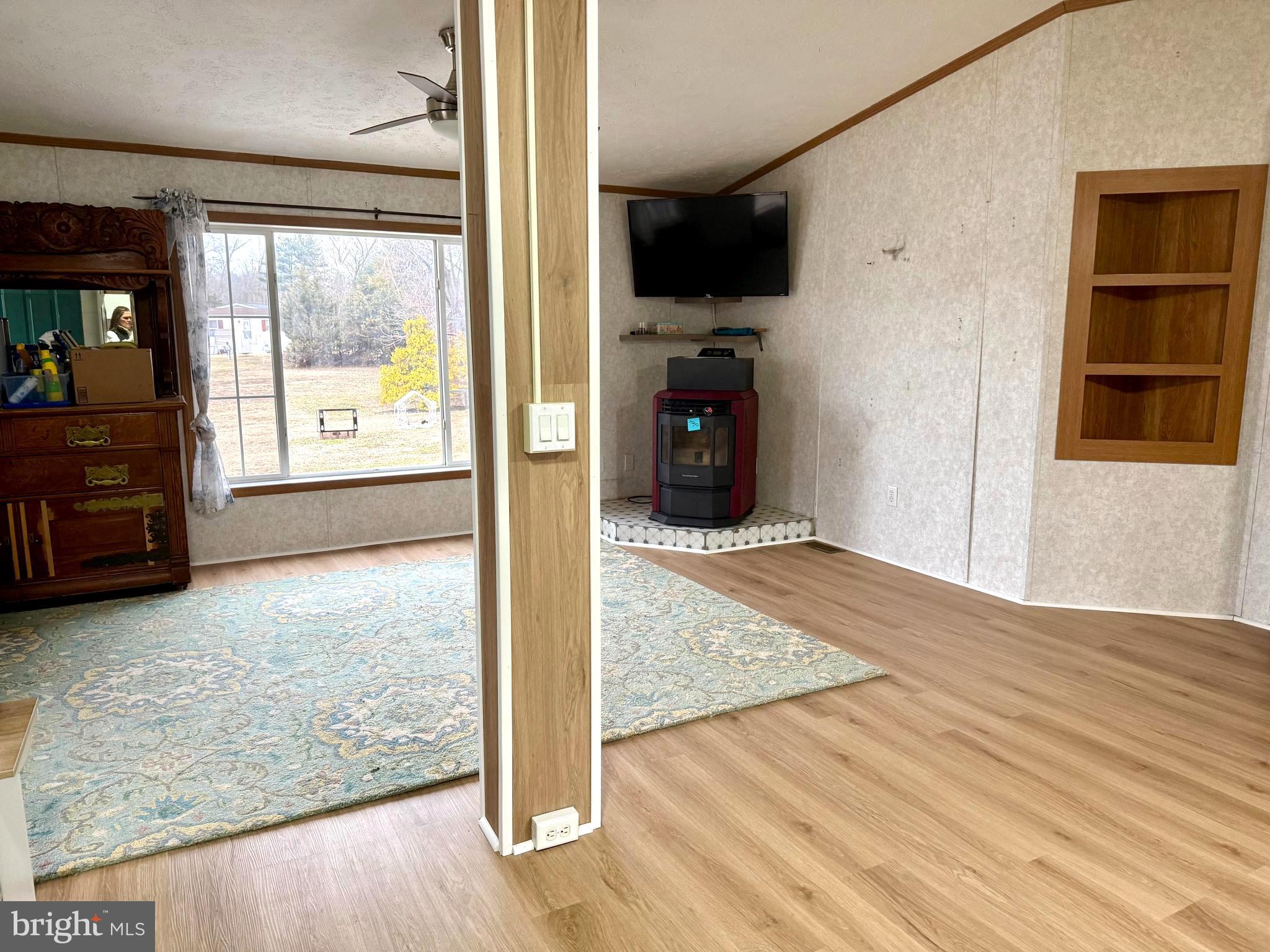 92 Arrowhead Road Shamong, NJ 08088 - Photo 13 of 25 a view of an empty room with a window and wooden floor
