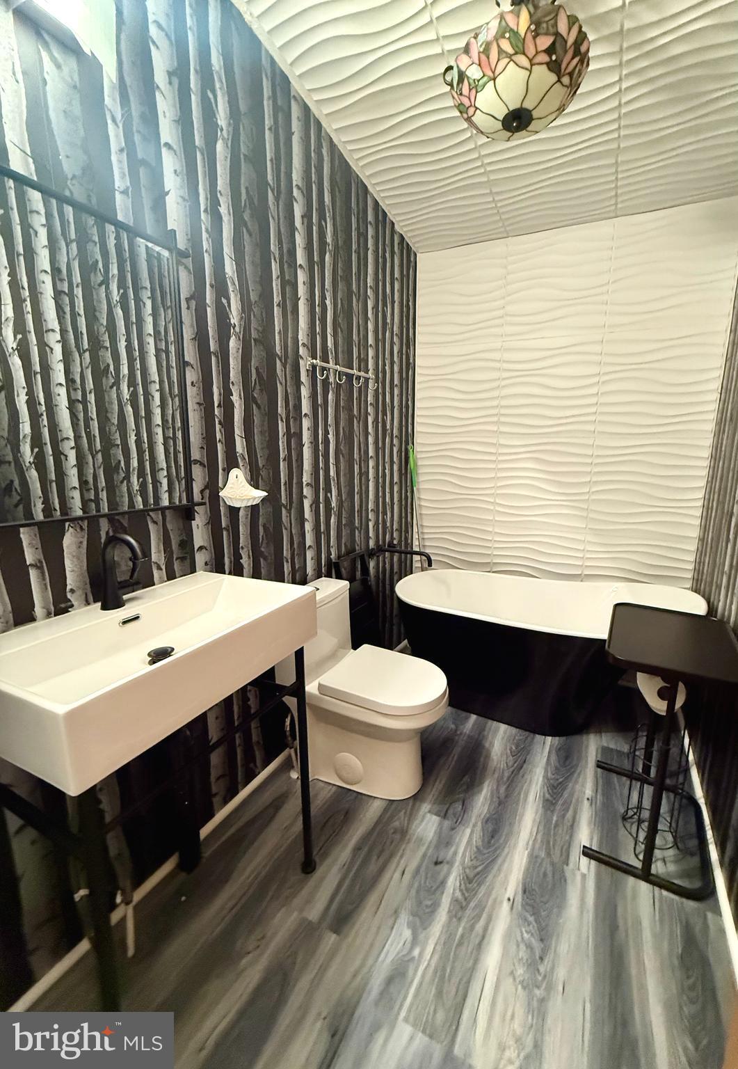 92 Arrowhead Road Shamong, NJ 08088 - Photo 17 of 25 a bathroom with a sink a toilet and bathtub